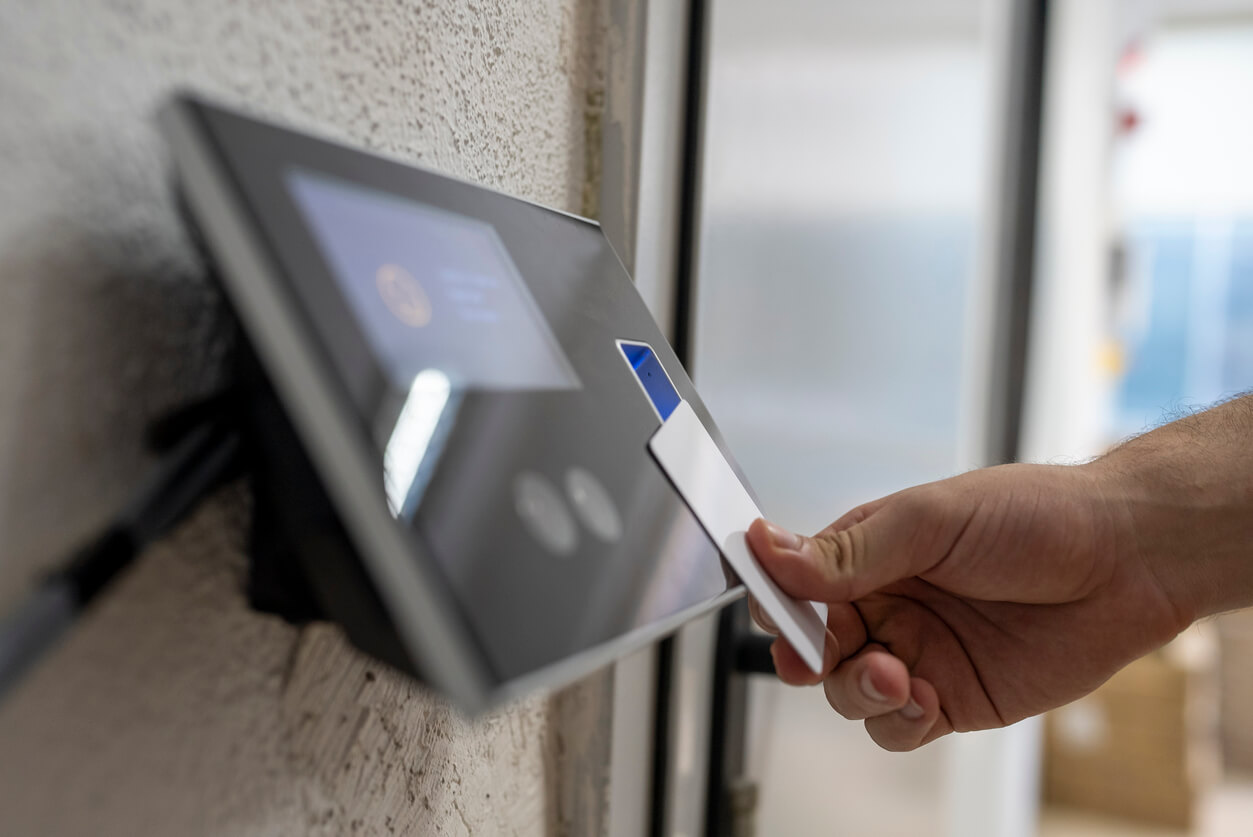 male hand holding key card to accessing the room Giving Facebook the thumbs down