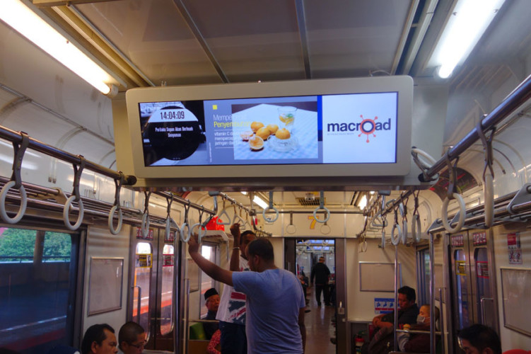 broadcasting advertisement inside Indonesian metro train Commuter