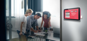 XDS-1078 with NFC technology installed on the wall outside meeting room