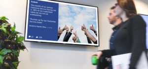 Social media post on digital signage across office