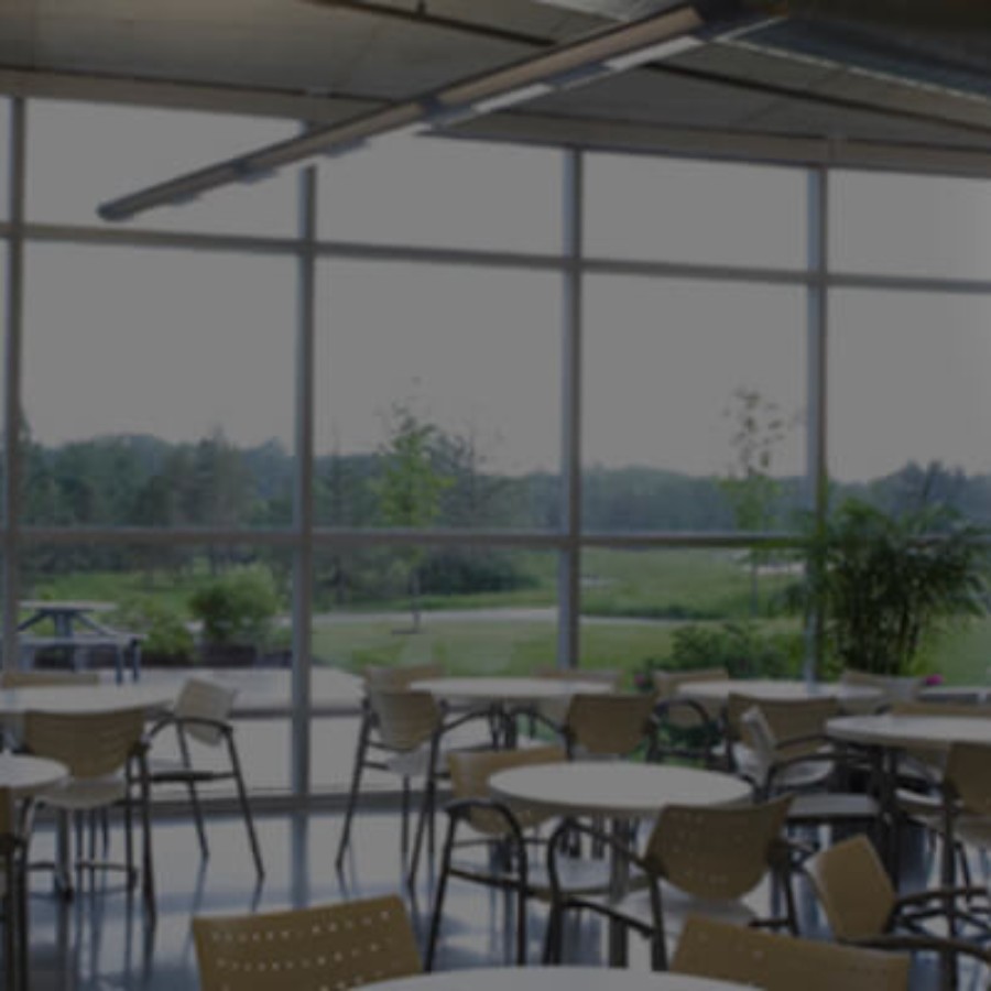 Indoor school dining area with seating, suitable for IAdea menu board digital signage