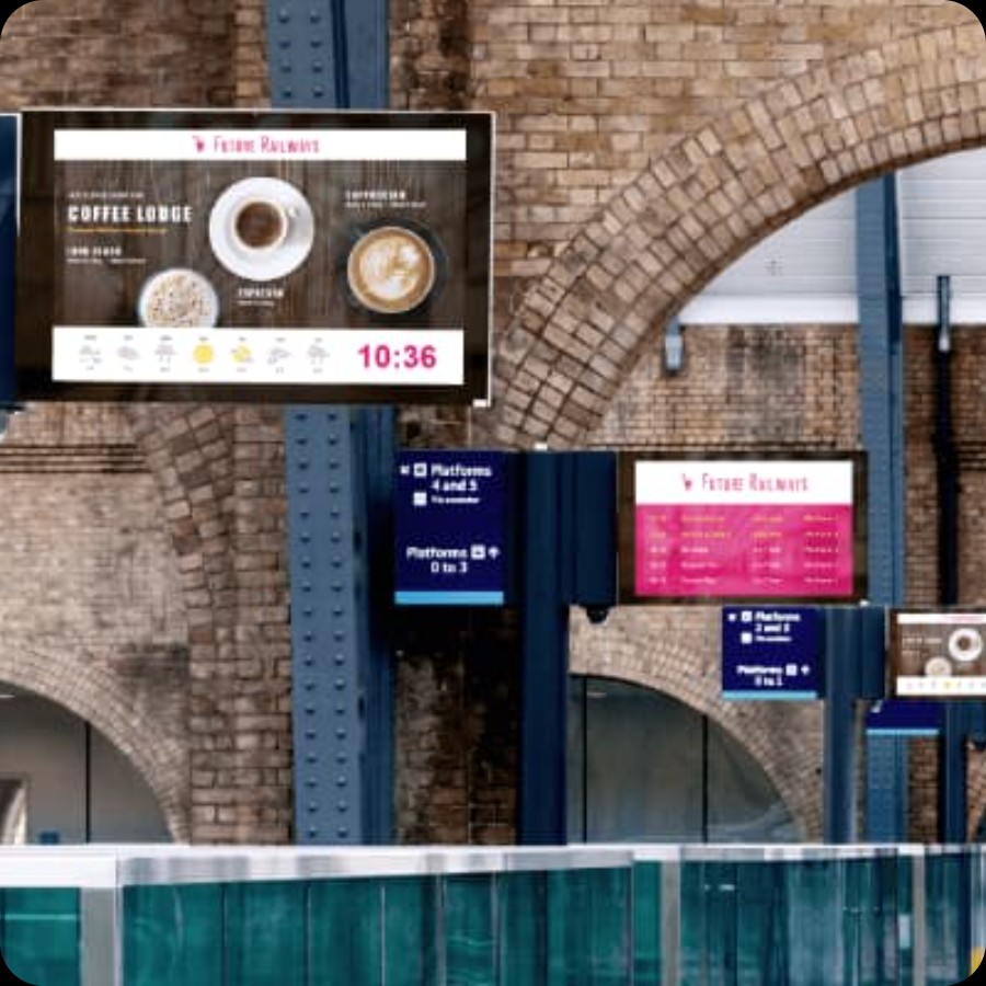 Train station platform with arrivals and departures signage boards for IAdea transportation displays